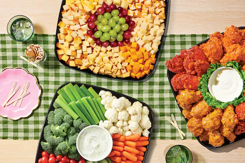 Variety of sub platters on a green checkerboard table cloth